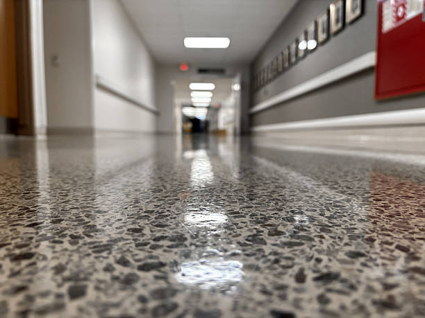 Specialist performing concrete polishing inside a Wolfforth, TX workspace using floor grinding equipment