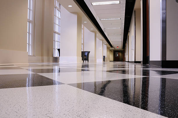 Technician performing concrete polishing on a commercial floor inside a Lubbock, TX building